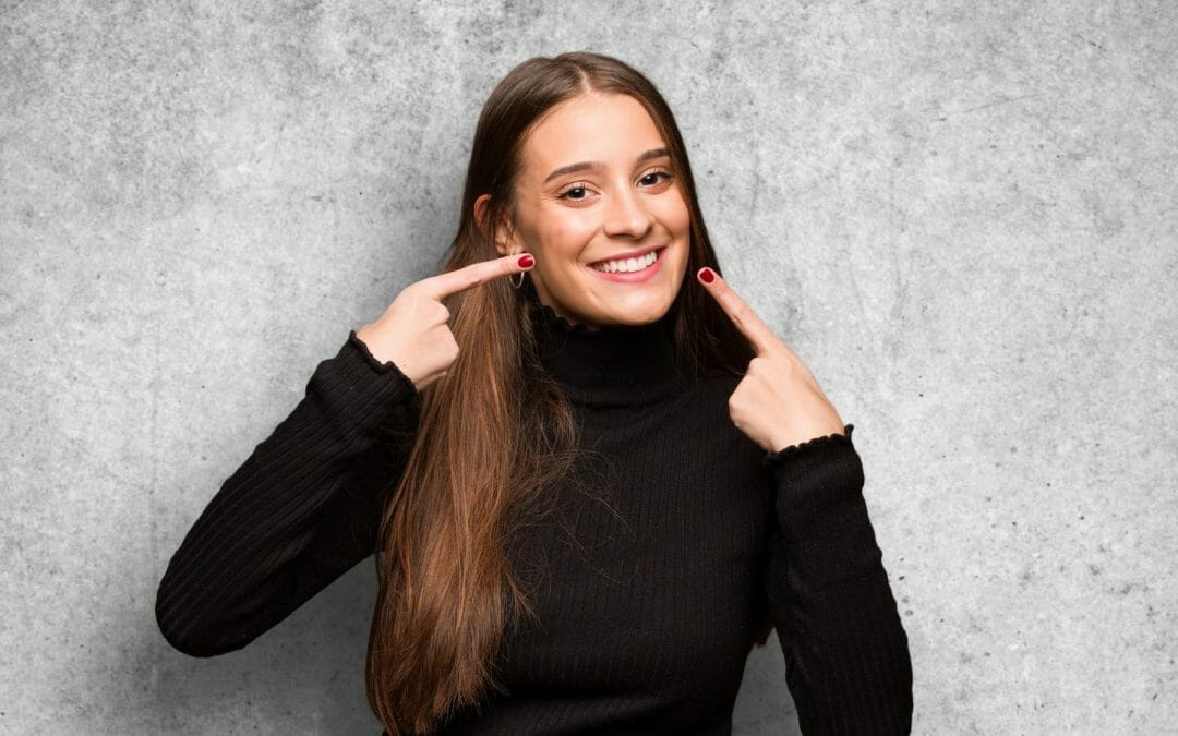 woman in black shirt smiling