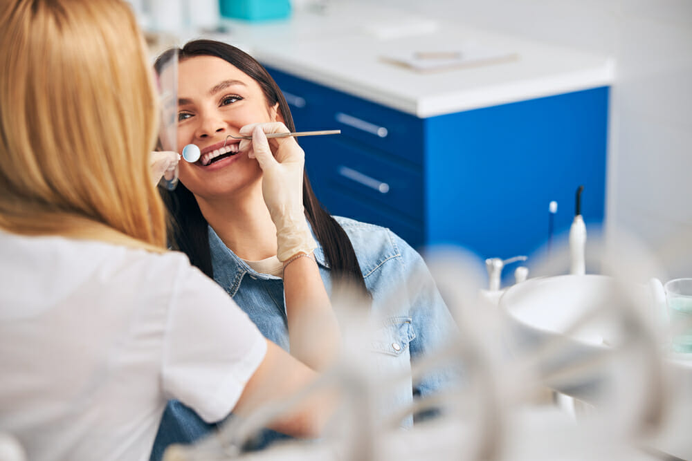 Woman Looking Really Happy to Get Her Teeth Cleaned