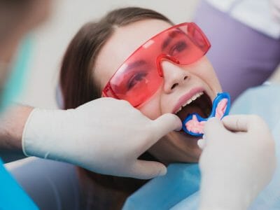 Woman getting fluoride treatment