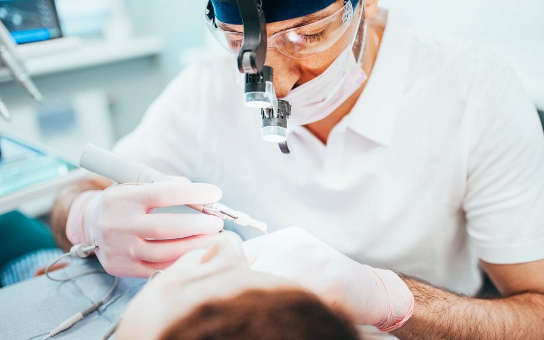 Dentist Performing Procedure on Patient