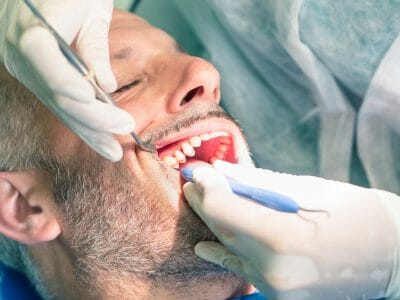 Man getting a root canal procedure done