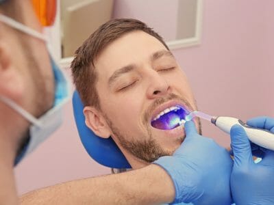 man getting his teeth examined